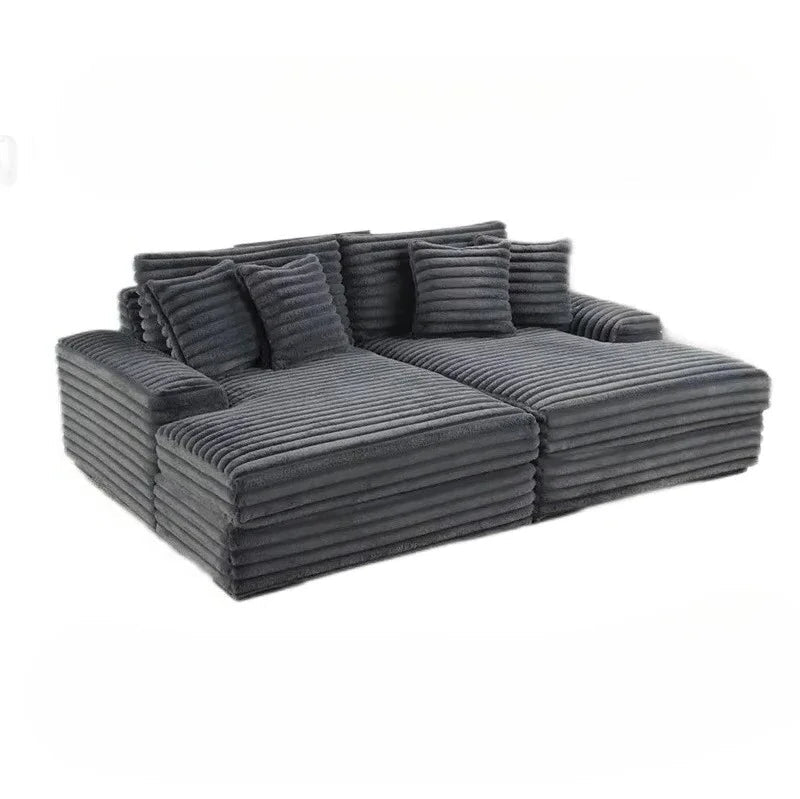 Gray sectional sofa with cushions on a white background