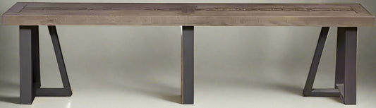 A two-tone bench with a reclaimed natural wood top and a black base, with a slightly distressed finish.