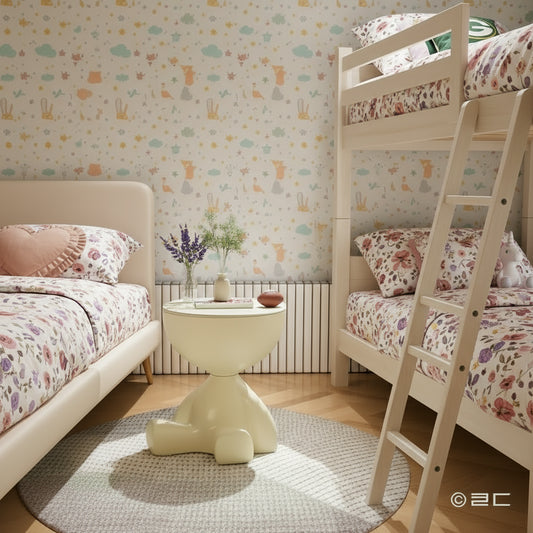Beige side table in a bedroom setting with a plant and book on top.