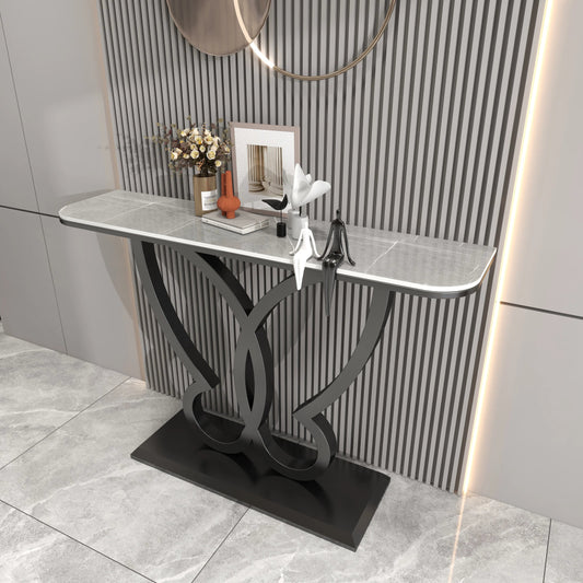 Console table with decorative items against a striped wall