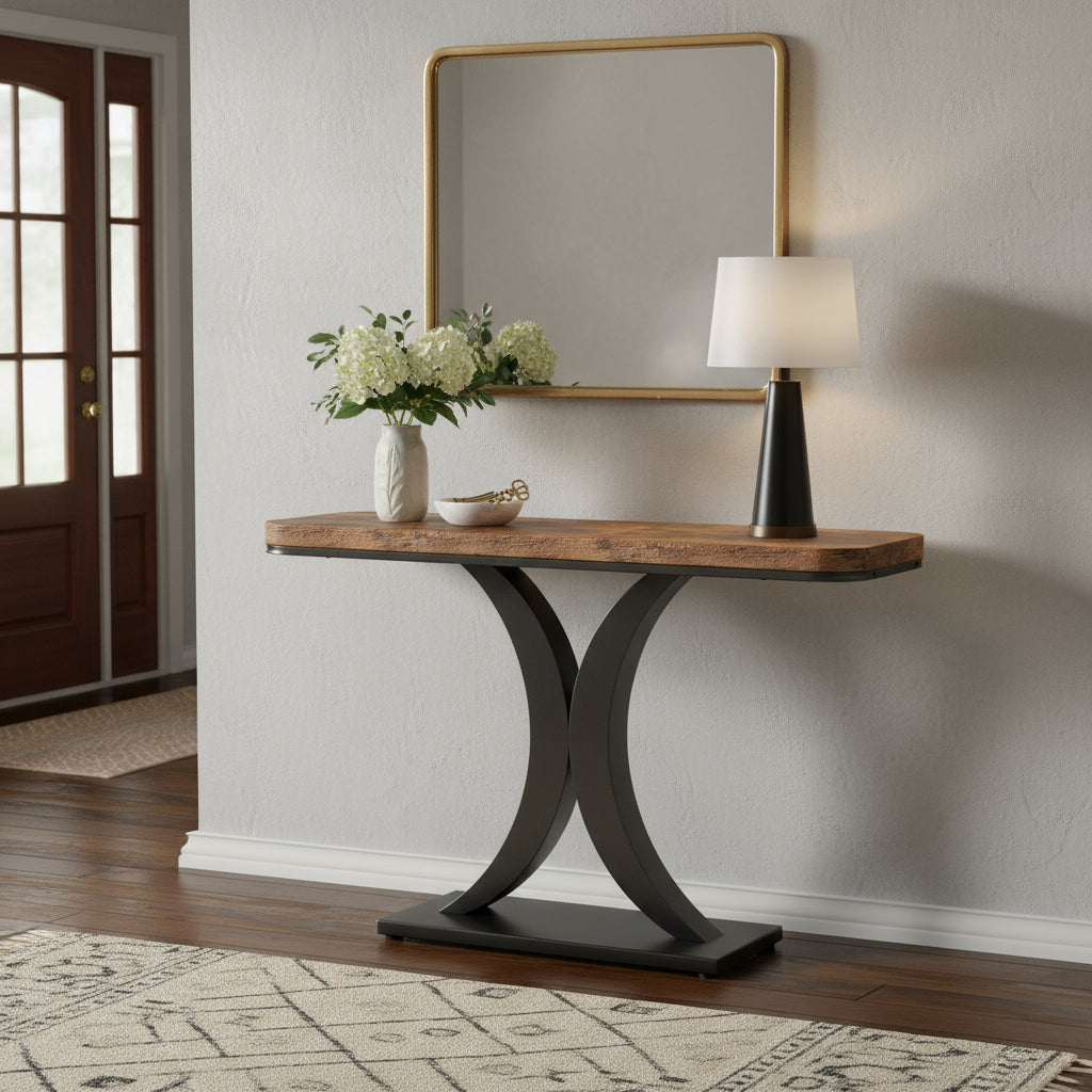 Console table with wooden top and black metal base on a white background