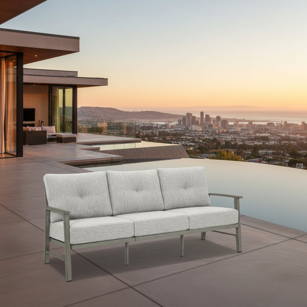 Gray outdoor sofa with metal frame on a white background