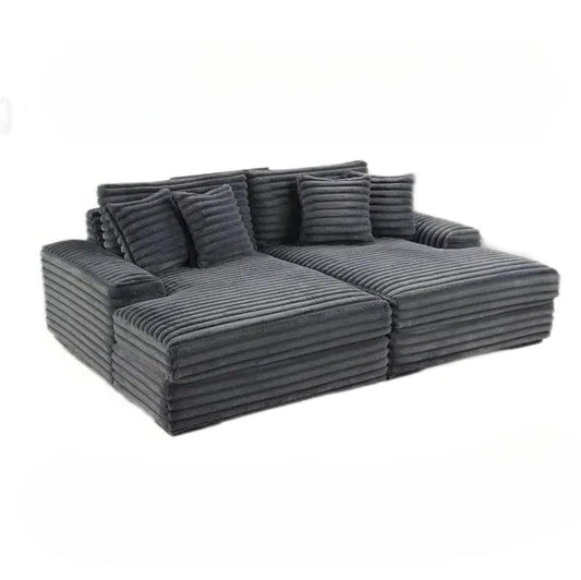 Gray sectional sofa with cushions on a white background