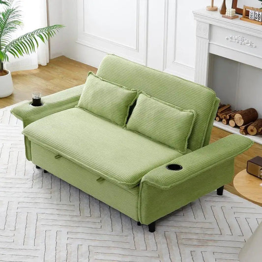 Green sofa bed in a living room setting with a fireplace and plants.