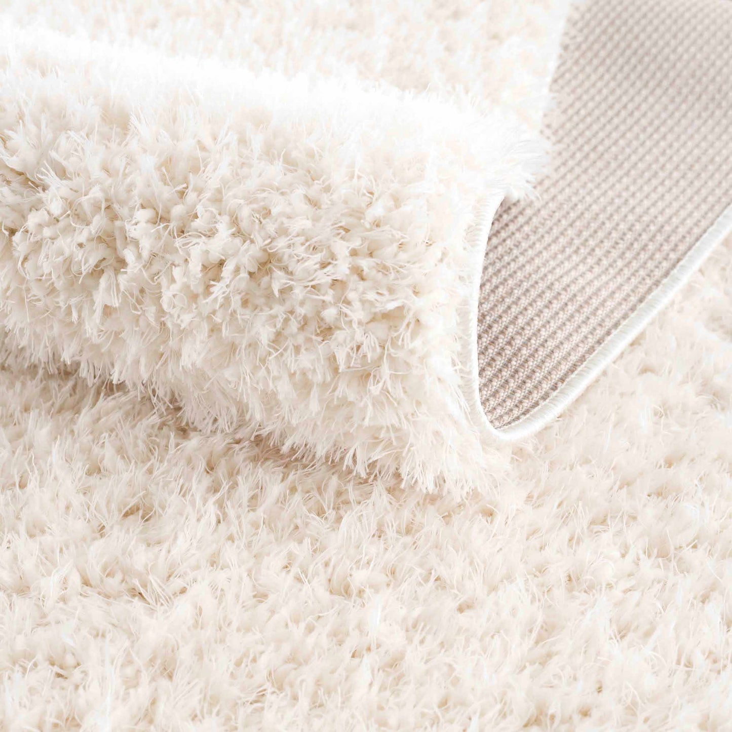 Faina Solid Cream Shag Washable Area Rug - Clearance