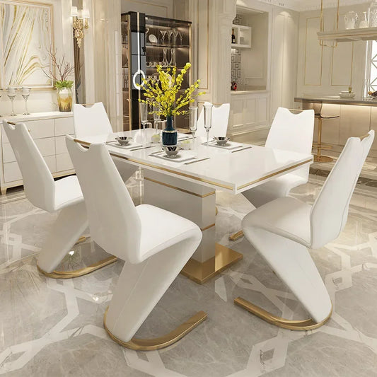 Modern dining room with a white table and chairs in a stylish interior.