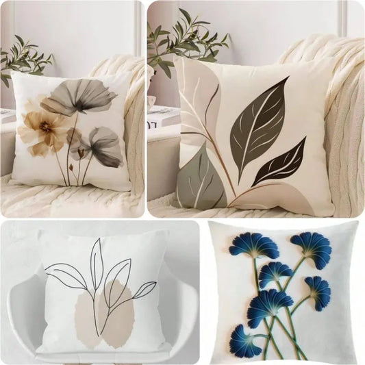 Set of decorative pillows with floral and leaf patterns on a neutral background.