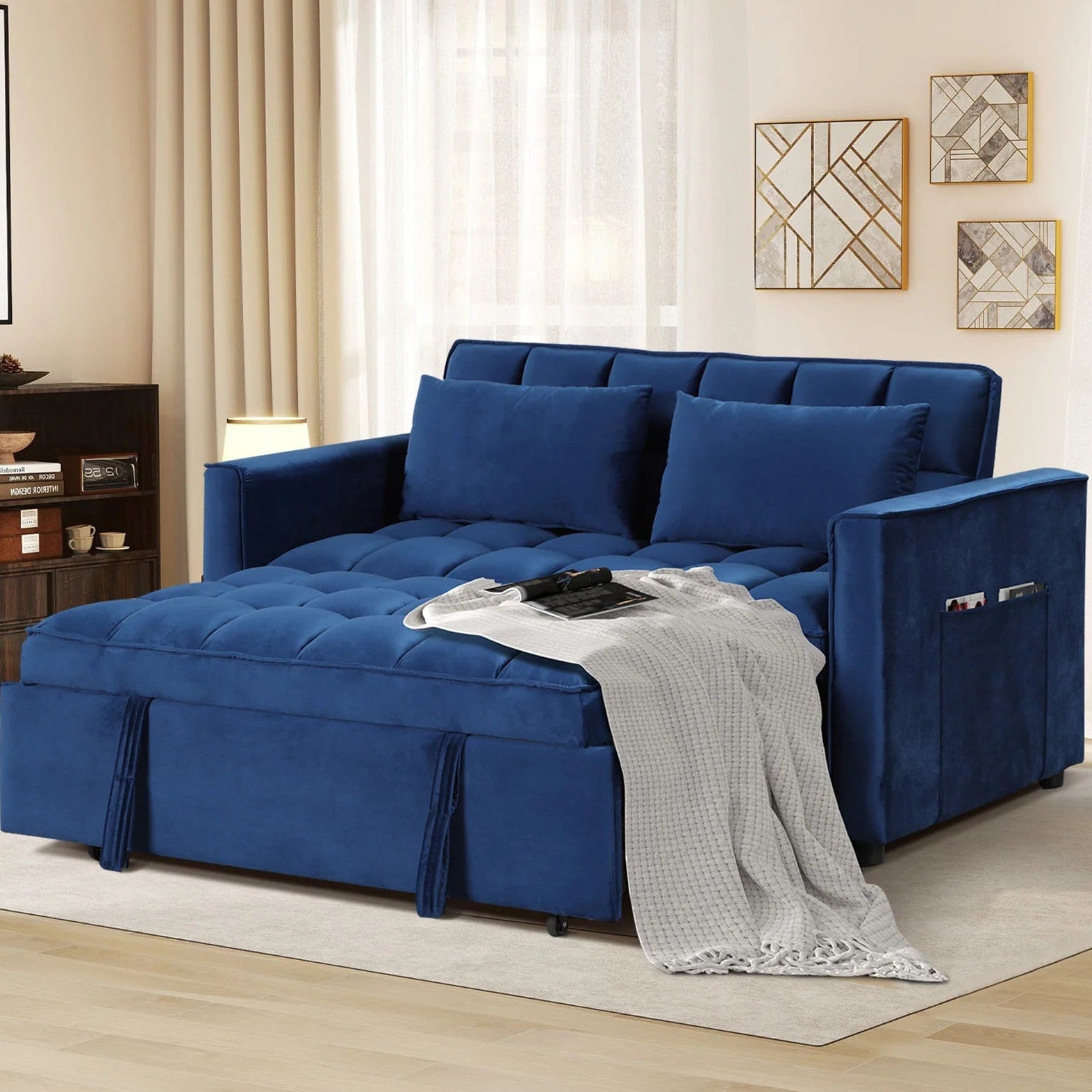 Blue sectional sofa in a living room setting with decor elements.